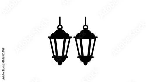 Pair of black hanging lanterns on white background.