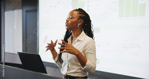 Presentation, public speaking or black woman with laptop at podium, company stats or performance data review. Business seminar, pc or worker with info analysis, charts or graphs for growth discussion