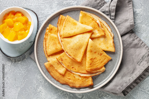 Photos Crepes (Russian Blini) on grey background,