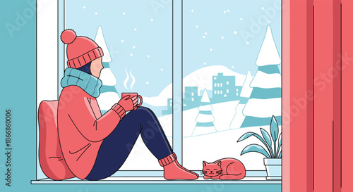 Cozy winter scene features a woman in warm clothes sitting by a window with a hot drink and her cat watching the falling snow in the city.