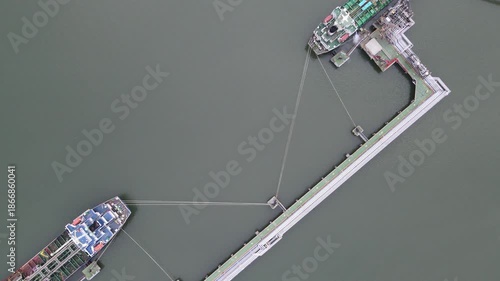 Drone Footage of Oil Tanker Docking at Industrial Port, Oil and Gas Shipping Industry, Aerial View from Above