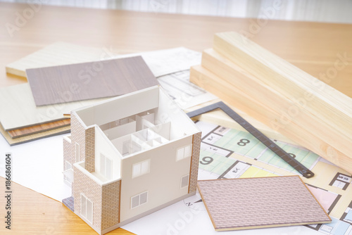 Schilderij op canvas 家づくりイメージの住宅模型と設計図