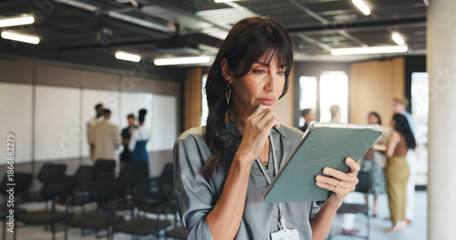 Photos Business, thinking and woman in workshop, tablet or seminar coordinator with solution
