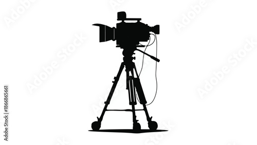 Professional video camera on tripod ready for recording, isolated on white background.