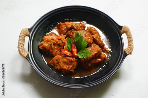 Spicy chicken stew in a plate 