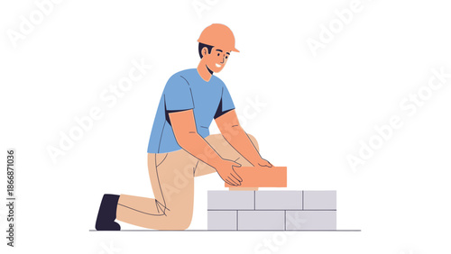 A man in a kneeling position laying bricks on a wall