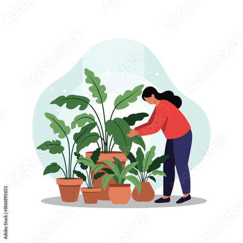Young woman enjoys her hobby of indoor gardening while carefully tending to various lush green house plants in clay pots at home.