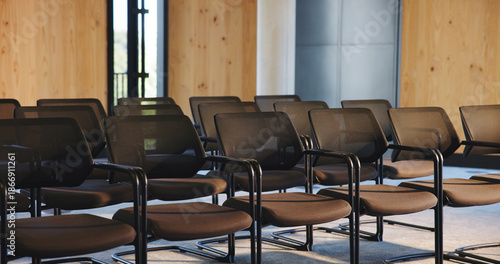 фотографія Chairs, seminar and empty room for business forum, event and convention or meeting venue