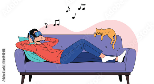 Young man relaxing on a blue sofa wearing a modern VR headset and listening to music with his ginger cat nearby.
