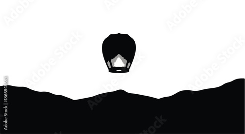 Black hot air balloon ascends over stylized dark landscape at dawn