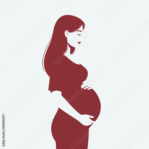 Pregnant woman in red dress holding belly