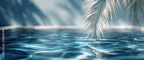 Blurred palm leaf shadows on a blue water background, a summer banner template with copy space for text