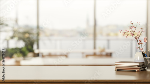 Canvastavla Books and pencil aside flower vase on wooden counter table across window wall in