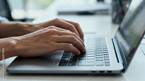 Cuadro en lienzo Close-Up of Hands Typing on Laptop Keyboard in Office Workspace