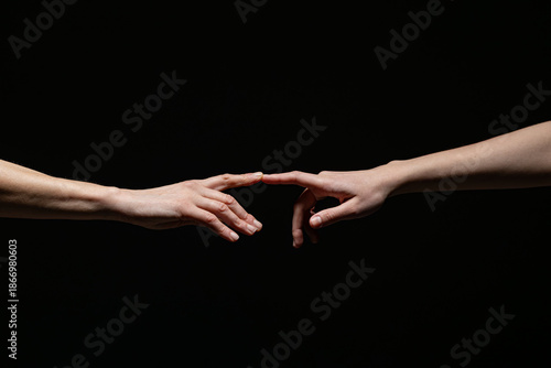 Wallpaper Mural Two outstretched hands reach toward each other, fingers nearly touching, against a dark background. Symbolizes connection, longing, or creation with ample copy space Torontodigital.ca