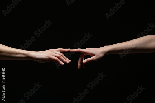 Wallpaper Mural Two outstretched hands reach toward each other, fingers nearly touching, against a dark background. Symbolizes connection, longing, or creation with ample copy space Torontodigital.ca