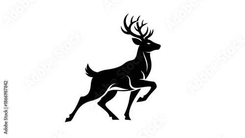 Majestic deer silhouette with prominent antlers, captured in a dynamic pose, showcasing its powerful presence.