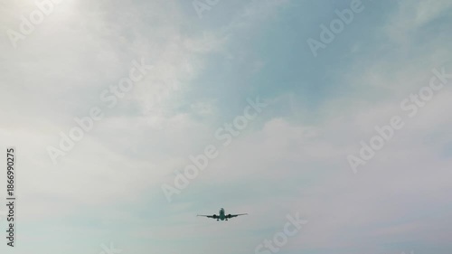 A commercial plane is landing at the airport.