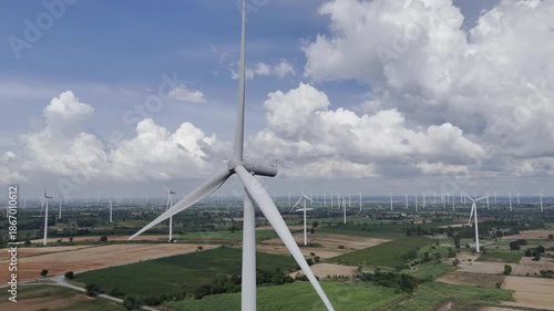 Wind turbines at green mountain hill clean sustainable electricity power, Green generator cloud blue sky fly over with drone shot