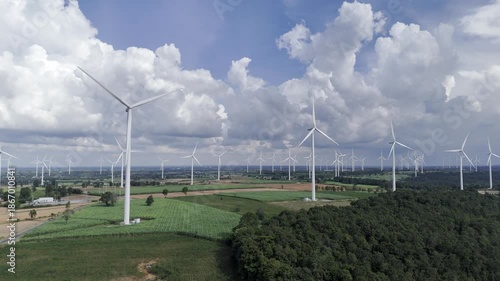 Wind turbines at green mountain hill clean sustainable electricity power, Green generator cloud blue sky fly over with drone shot