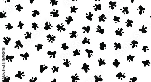 Simple seamless monochrome pattern of abstract black inkblots or cow spots scattered randomly on a clean white background.