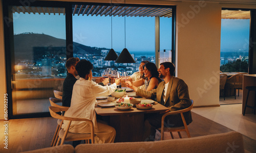 Friends enjoying an evening dinner together with a scenic view