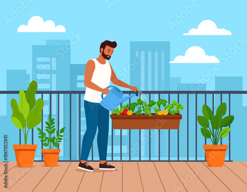 A man watering plants in a planter box on a city apartment balcony with potted plants and buildings in the background.