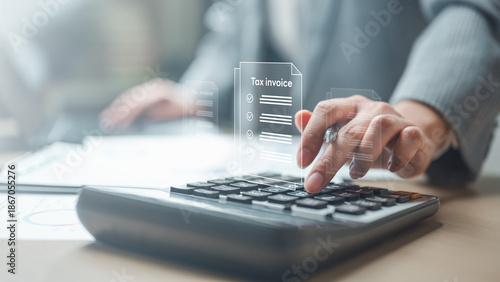 Foto tax, invoice, receipt, document, A business person using a calculator with digital tax invoice documents, representing billing, tax calculation, accounting tasks, and financial record management