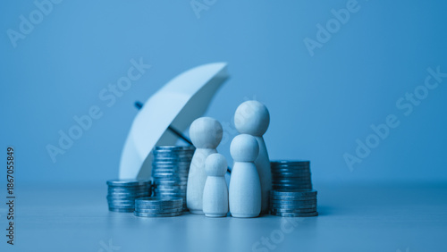 life, insurance, family, protection, beneficiaries, Wooden family figures beside stacked coins and an umbrella symbolize life insurance protection, financial security, and support for dependents.