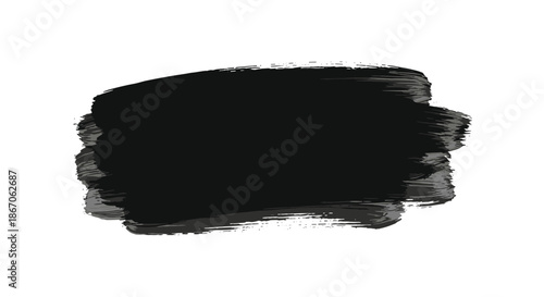 Bold and artistic black paint brush stroke texture with expressive edges isolated on a clean white background for various design projects.