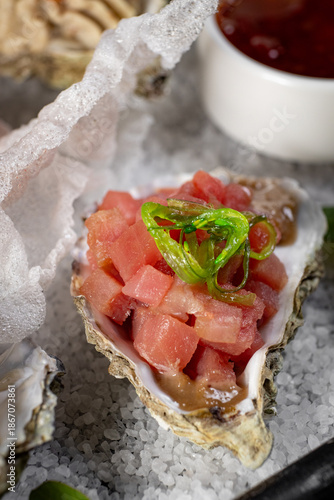 Healthy food. Seafood and toast in a frying pan on a wooden board on a black background.
