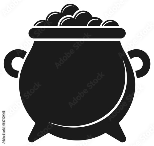 Black cauldron filled with round objects on a white background