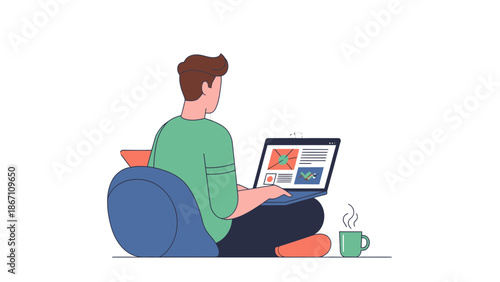 A man sits on a bean bag chair working on a laptop with a cup of coffee beside him in a relaxed home setting