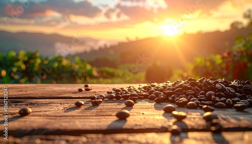 Coffee beans scattered on a wooden table against a warm-toned background at sunrise