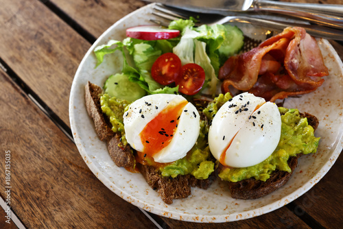 traditional breakfast with fried egg and salad
