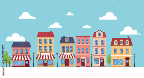 Picturesque row of colorful European style townhouses with red roofs and storefronts under a bright blue sky.