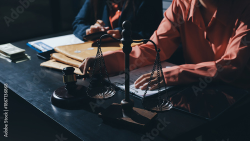 Consultation and conference of professional businesswoman and Male lawyers working and discussion having at law firm in office. Concepts of law, Judge gavel with scales of justice