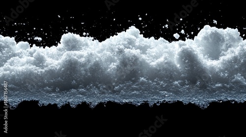 Crashing ocean wave with white foam on black background