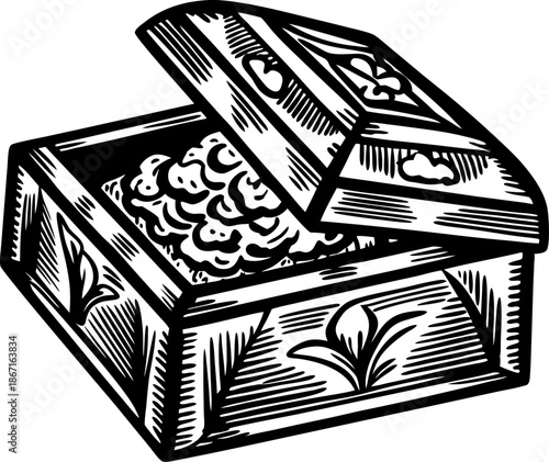 Decorative wooden box with floral carvings and open lid displaying contents inside