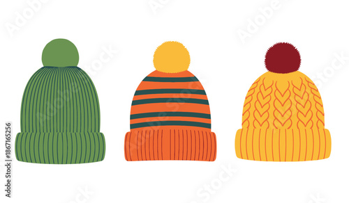 Colorful knit hats with pom poms in green, orange, and yellow
