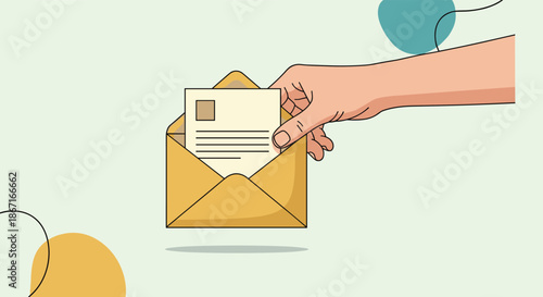 Hand inserting a letter or postcard into a yellow paper envelope against a light green background with abstract decorative shapes.