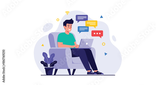 Happy young man sitting in a comfortable armchair, smiling while chatting online or working remotely on his laptop from home.