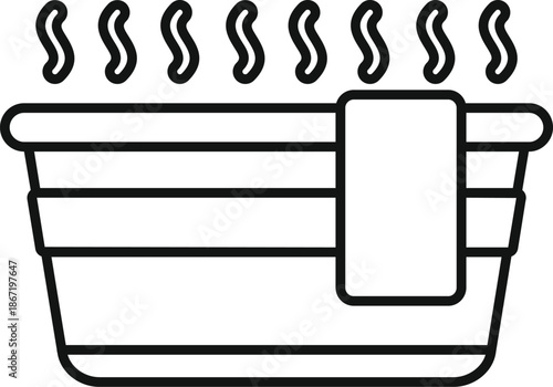 Hot water basin with towel showing steam for cleaning or spa