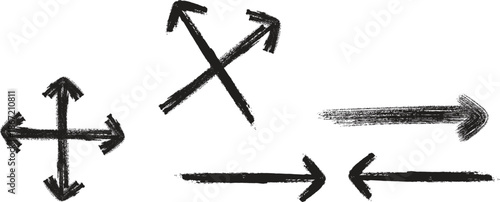 A collection of hand drawn arrows and cross symbols created with rough black sketching lines on a white