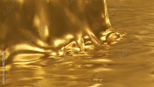 Golden Liquid Splash in Luxurious Flow with Warm Lighting on Smooth Surface for Premium Branding