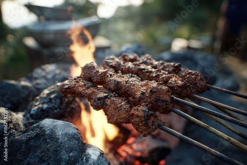 Grilled skewers over campfire