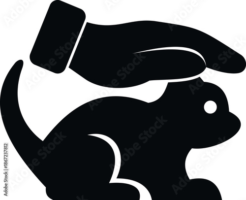 Hand protecting a small kitten or puppy, symbolizing animal care and shelter