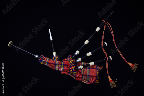 Scottish Great Highland bagpipes on a black background