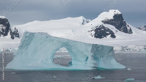 Iceberg formation observed in the ocean around Greenland on a clear day in summer