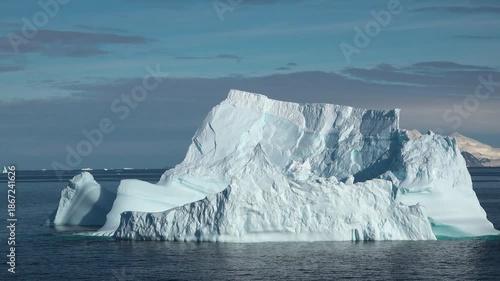 Iceberg formation observed in the ocean around Greenland on a clear day in summer